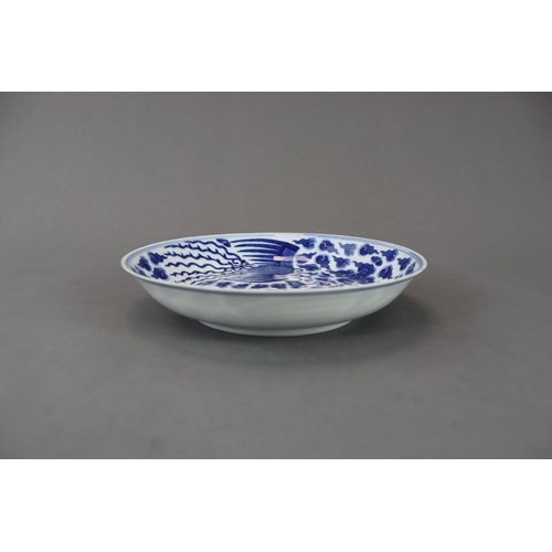 99 - A Blue and White Phoenix Dish, Guangxu mark and of the period painted in soft deep tones on the inte... 