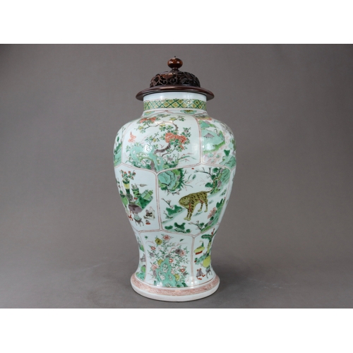 103 - A 'famille verte' Baluster Vase, Kangxi,  the sides attractively decorated with three bands of lotus... 