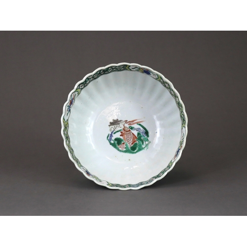 104 - A 'famille verte' Dragon Bowl, Kangxi,  the fluted sides strikingly enamelled with three fierce drag... 