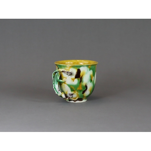 105 - An 'Egg and Spinach' Winecup, Kangxi, of deep rounded form with moulded chilong loop handle, covered... 