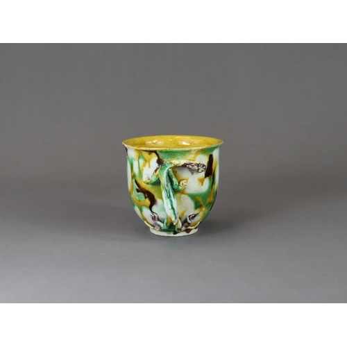 105 - An 'Egg and Spinach' Winecup, Kangxi, of deep rounded form with moulded chilong loop handle, covered... 