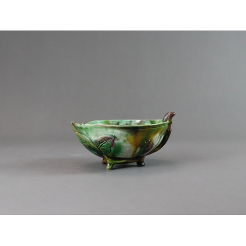 106 - A Peach Shaped 'Egg and Spinach' Winecup, Kangxi, the elegant vessel thinly potted as a fruiting pea... 