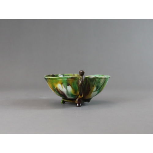 106 - A Peach Shaped 'Egg and Spinach' Winecup, Kangxi, the elegant vessel thinly potted as a fruiting pea... 