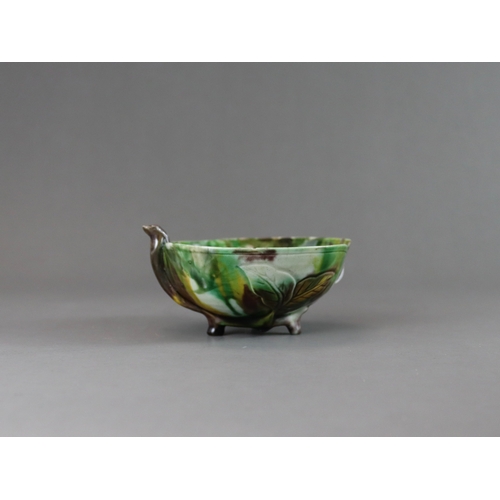 106 - A Peach Shaped 'Egg and Spinach' Winecup, Kangxi, the elegant vessel thinly potted as a fruiting pea... 