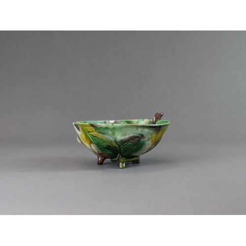 106 - A Peach Shaped 'Egg and Spinach' Winecup, Kangxi, the elegant vessel thinly potted as a fruiting pea... 