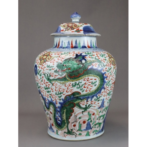 109 - A Striking Wucai Baluster Dragon Jar and Cover, Shunzhi, richly decorated in strong enamels and dark... 