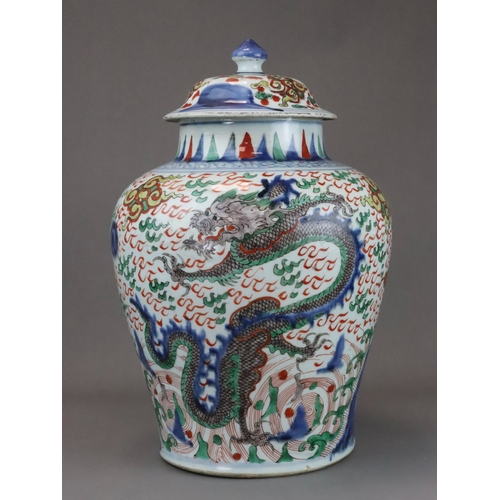 109 - A Striking Wucai Baluster Dragon Jar and Cover, Shunzhi, richly decorated in strong enamels and dark... 