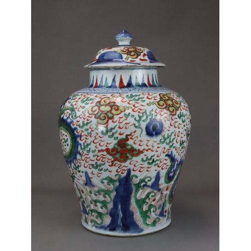 109 - A Striking Wucai Baluster Dragon Jar and Cover, Shunzhi, richly decorated in strong enamels and dark... 