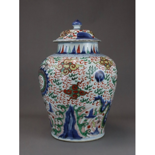 109 - A Striking Wucai Baluster Dragon Jar and Cover, Shunzhi, richly decorated in strong enamels and dark... 