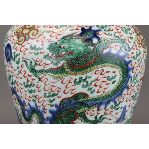 109 - A Striking Wucai Baluster Dragon Jar and Cover, Shunzhi, richly decorated in strong enamels and dark... 