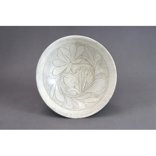 11 - A Cizhou Carved Floral Dish, Jin dynasty the deep rounded sides flaring from the straight foot to th... 