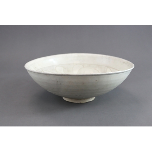 11 - A Cizhou Carved Floral Dish, Jin dynasty the deep rounded sides flaring from the straight foot to th... 