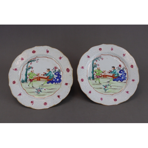 113 - An Unusual Pair of 'famille rose' European Subject Plates, Qianlong, with a central garden scene of ... 