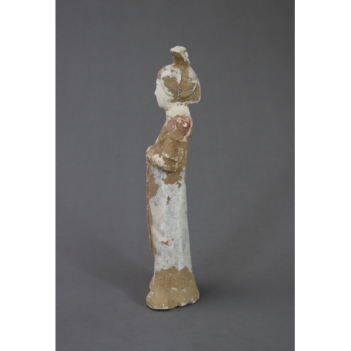 12 - A Painted Pottery Figure of a Lady, Tang dynasty modelled from red pottery, the lady with high hair ... 