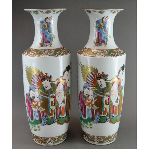 121 - A Large Pair of 'Canton famille rose' Vases with Figures, 19th century, of tall rouleau form, finely... 