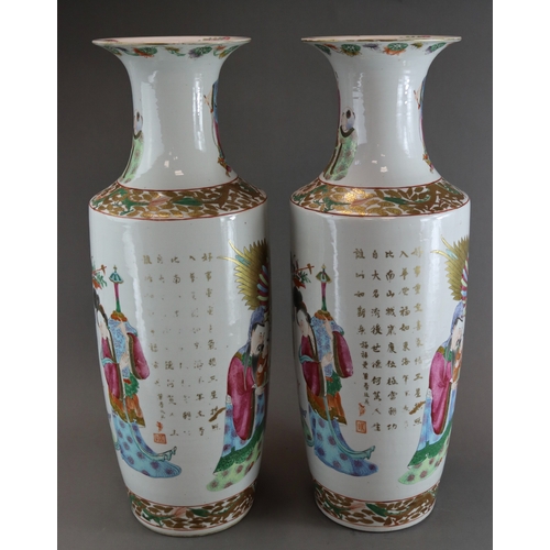 121 - A Large Pair of 'Canton famille rose' Vases with Figures, 19th century, of tall rouleau form, finely... 