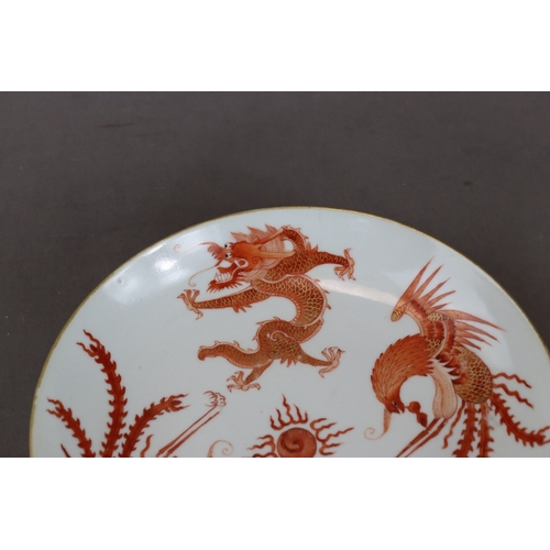 123 - A Dragon and Phoenix Dish, Jiaqing six character seal mark in underglaze blue and of the period,  we... 