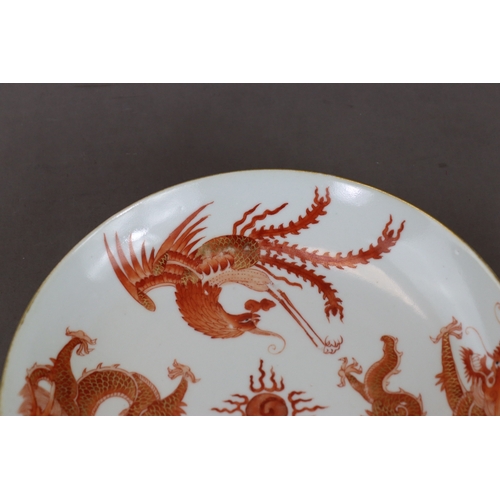 123 - A Dragon and Phoenix Dish, Jiaqing six character seal mark in underglaze blue and of the period,  we... 