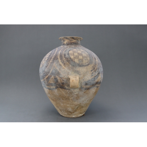 13 - A Majiayao Painted Pottery Handled Jar, Majiayao Culture, Machang Phase the ovoid body surmounted by... 