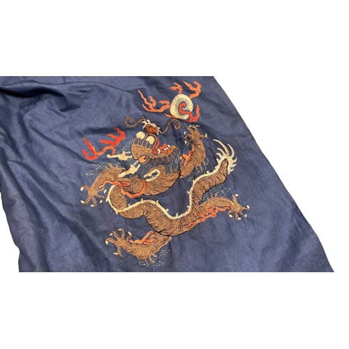 135 - An Embroidered Blue Ground Dragon Robe, 19th century with golden dragons among clouds, interspersed ... 