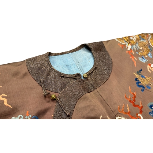 136 - An Embroidered Dragon Court Robe, 19th century richly decorated on the 'cafe au lait' field with fiv... 