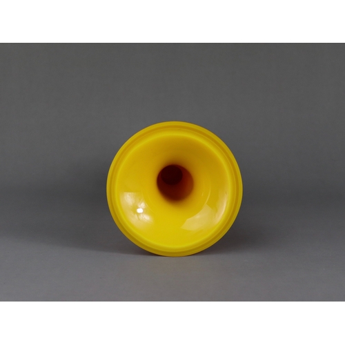 141 - A Yellow Pekin Glass Beaker Vase, gu, Qing dynasty,  the smooth entirely undecorated egg yellow vase... 