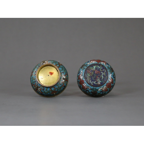 146 - A Good Cloisonne Box and Cover, early 18th century,  of compressed rounded form, the central blue gr... 