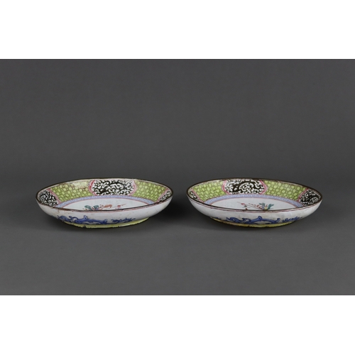 155 - A Pair of Canton Enamel Saucer Dishes, Qianlong,  each finely enamelled with a central medallion of ... 