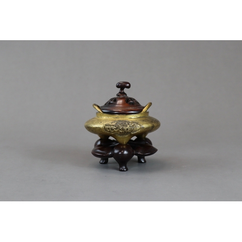 159 - A Fine Gilt Bronze Tonkin Ware Tripod Censer, liding, 18th century,  of compressed circular form on ... 