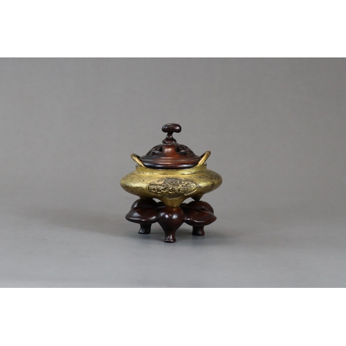 159 - A Fine Gilt Bronze Tonkin Ware Tripod Censer, liding, 18th century,  of compressed circular form on ... 