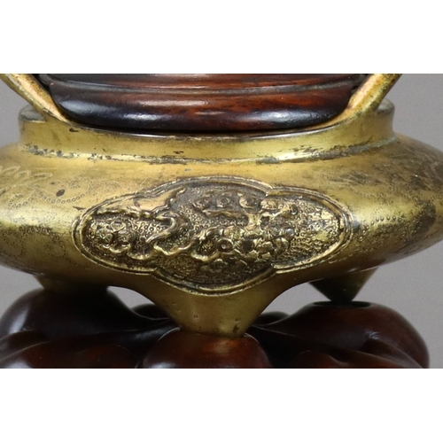 159 - A Fine Gilt Bronze Tonkin Ware Tripod Censer, liding, 18th century,  of compressed circular form on ... 