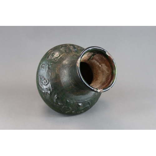 16 - A Green glazed Pottery Vase, hu, Han dynasty moulded in low relief around the shoulder beneath  the ... 