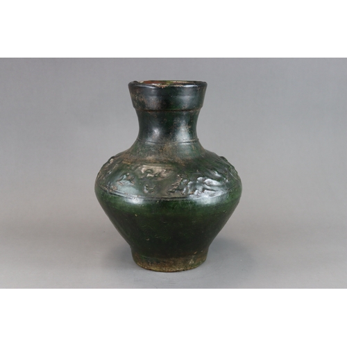 16 - A Green glazed Pottery Vase, hu, Han dynasty moulded in low relief around the shoulder beneath  the ... 