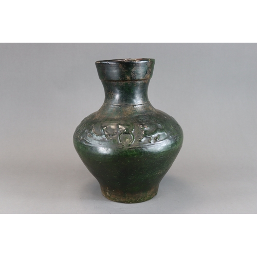 16 - A Green glazed Pottery Vase, hu, Han dynasty moulded in low relief around the shoulder beneath  the ... 