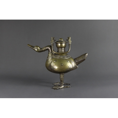 162 - A Bronze Ewer  and Cover in the form of a Goose, Ming dynasty or earlier,  the standing bird cast  w... 