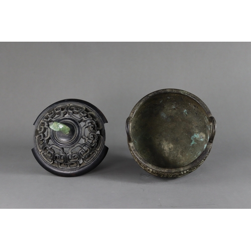 163 - A Bronze Tripod Censer, liding, Qing dynasty, well decorated around the exterior in crisp low relief... 