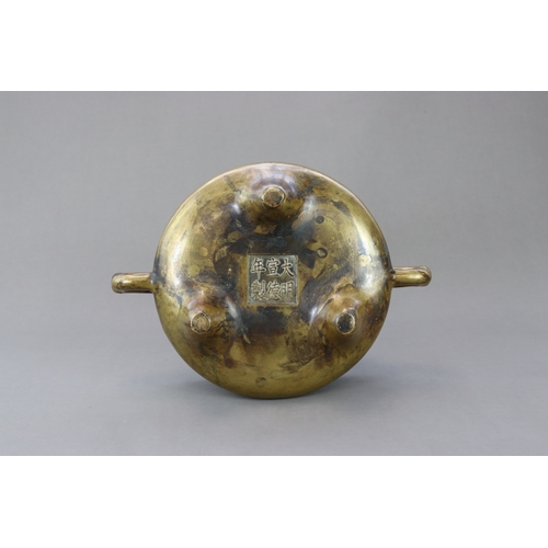 165 - A Bronze Tripod Censer, Qing dynasty, the massively cast undecorated censer of wide bombe form, stan... 