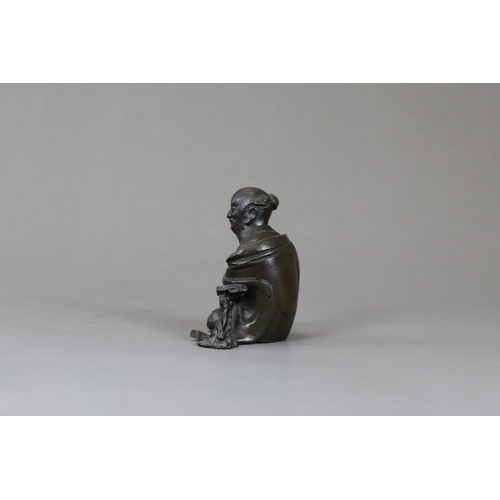 166 - A Bronze Seated Sage, 17th century,  with long beard and serene gaze,  finely cast leaning on a rock... 