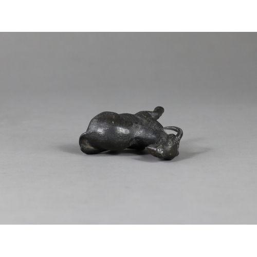 167 - A Bronze Goat Paperweight, Qing dynasty,  the seated long horned beast with head raised, looking ale... 