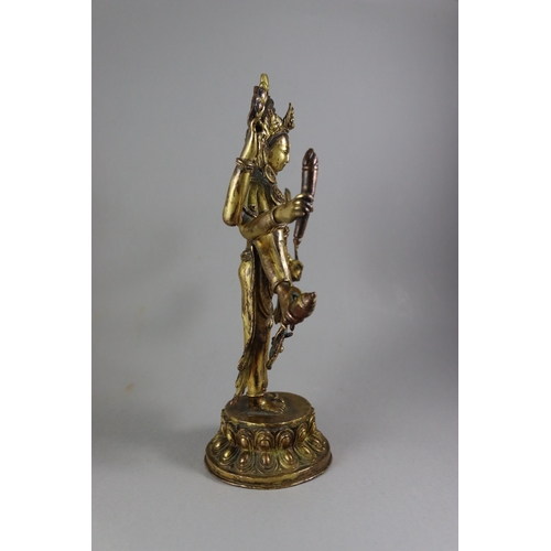 168 - A Rare Gynandromorphic Gilt Bronze Bodhisattva, 18/19th century,  the finely worked eight armed deit... 