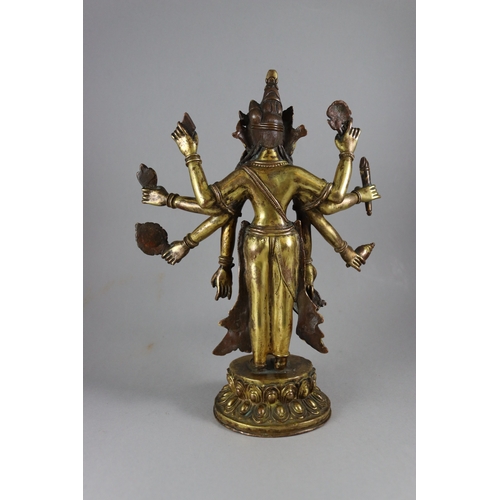 168 - A Rare Gynandromorphic Gilt Bronze Bodhisattva, 18/19th century,  the finely worked eight armed deit... 