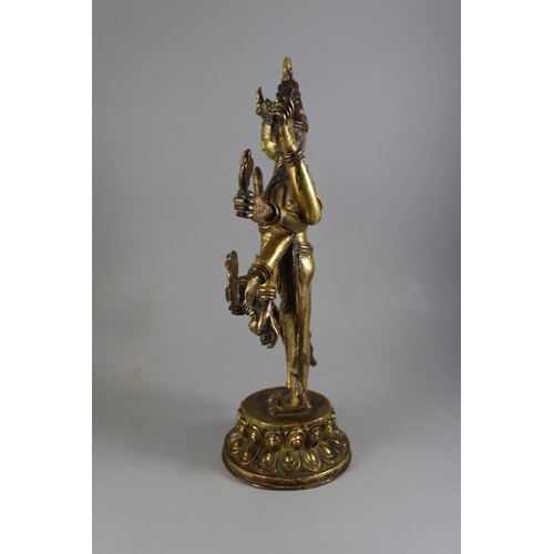 168 - A Rare Gynandromorphic Gilt Bronze Bodhisattva, 18/19th century,  the finely worked eight armed deit... 