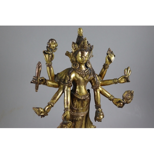 168 - A Rare Gynandromorphic Gilt Bronze Bodhisattva, 18/19th century,  the finely worked eight armed deit... 