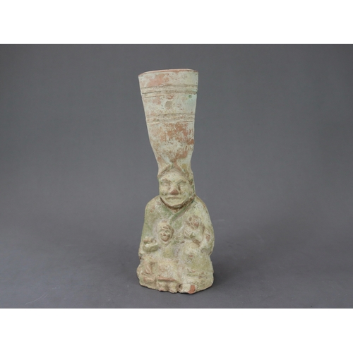 17 - A Rare Green-glazed Pottery 'Figural' Lamp, Han Dynasty  the lamp shaped as a kneeling female figure... 