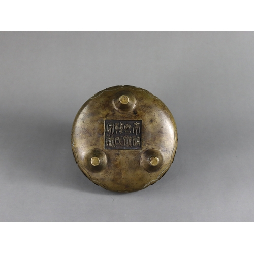 170 - An Arabic Inscribed Bronze Tripod Censer, li ding, Qing dynasty,  of low bombe form standing on mamm... 