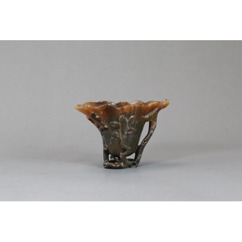 172 - A Rhinoceros Horn Libation Cup, 17th/18th century,  well carved in high and pierced relief as a larg... 