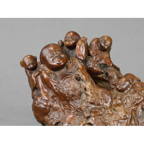 175 - A Good Rootwood Group with Budai, Qing dynasty, expressively carved with the fat and cheerful deity ... 