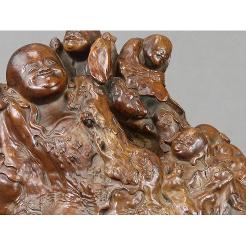 175 - A Good Rootwood Group with Budai, Qing dynasty, expressively carved with the fat and cheerful deity ... 