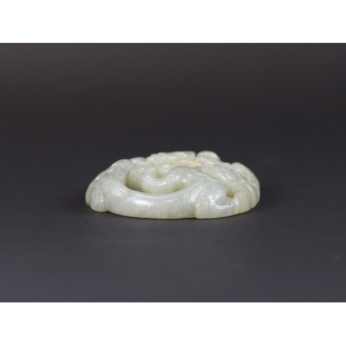 178 - A Jade Double Chilong Plaque, Ming dynasty,  of slightly domed oval form, softly carved in deep open... 