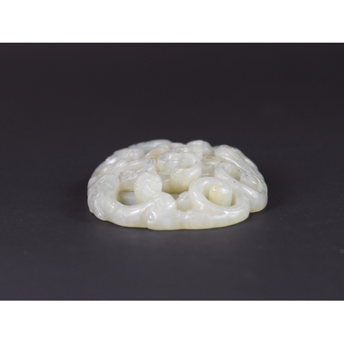 178 - A Jade Double Chilong Plaque, Ming dynasty,  of slightly domed oval form, softly carved in deep open... 